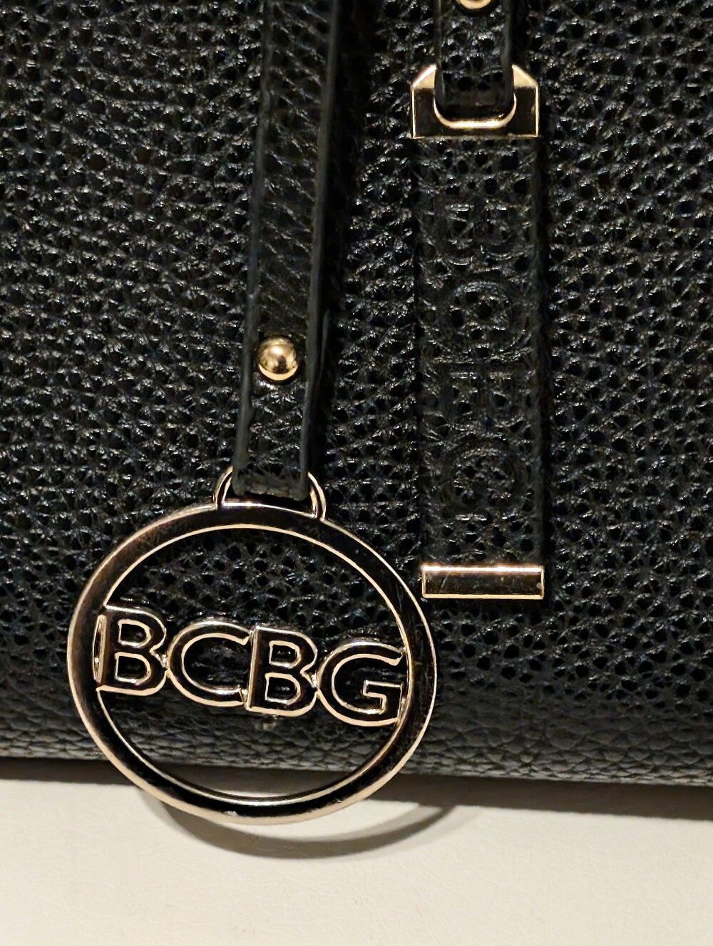 BCBG Large Black Tote with Gold Chain Trim and Logo Charm Duffle Bag..